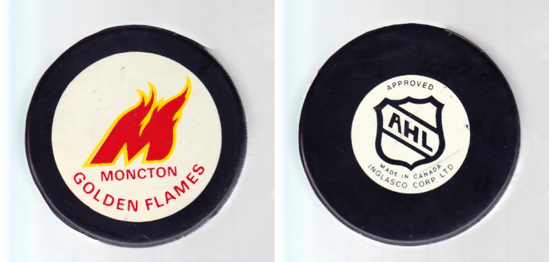 1986-93 AHL IN GLAS CO MONCTON GOLDEN FLAMES GAME PUCK photo 1986-93 AHL IN GLAS CO MONCTON GOLDEN FLAMES GAME PUCK photo